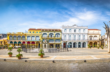 Enjoy the Plaza Vieja in the old town of Havana by hired car
