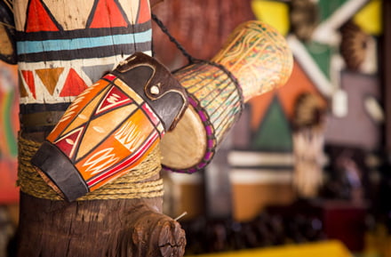 Hire a car and drive to the Lesedi Cultural Village